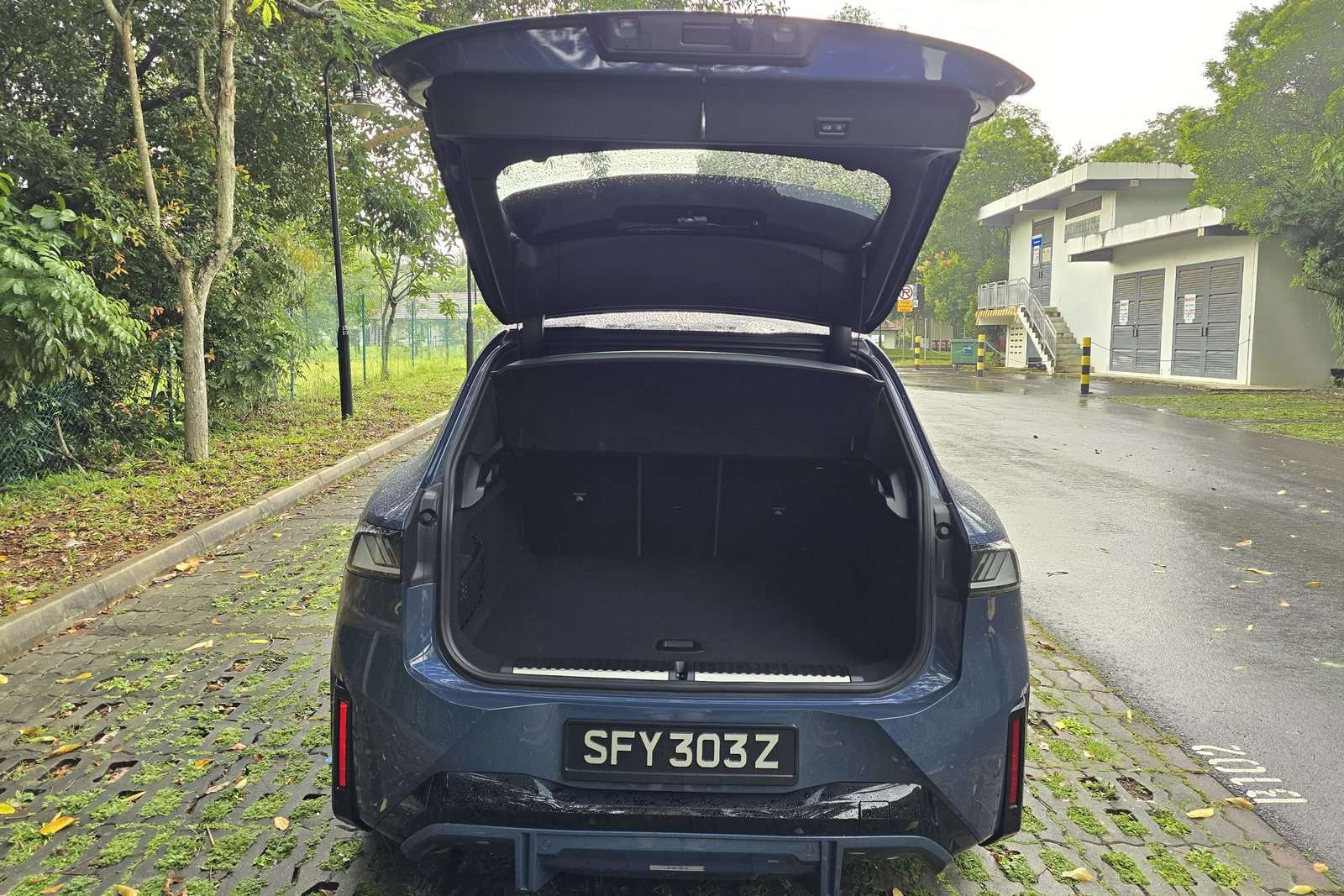 BMW iX3 boot open, showing the load floor and full width of the luggage opening