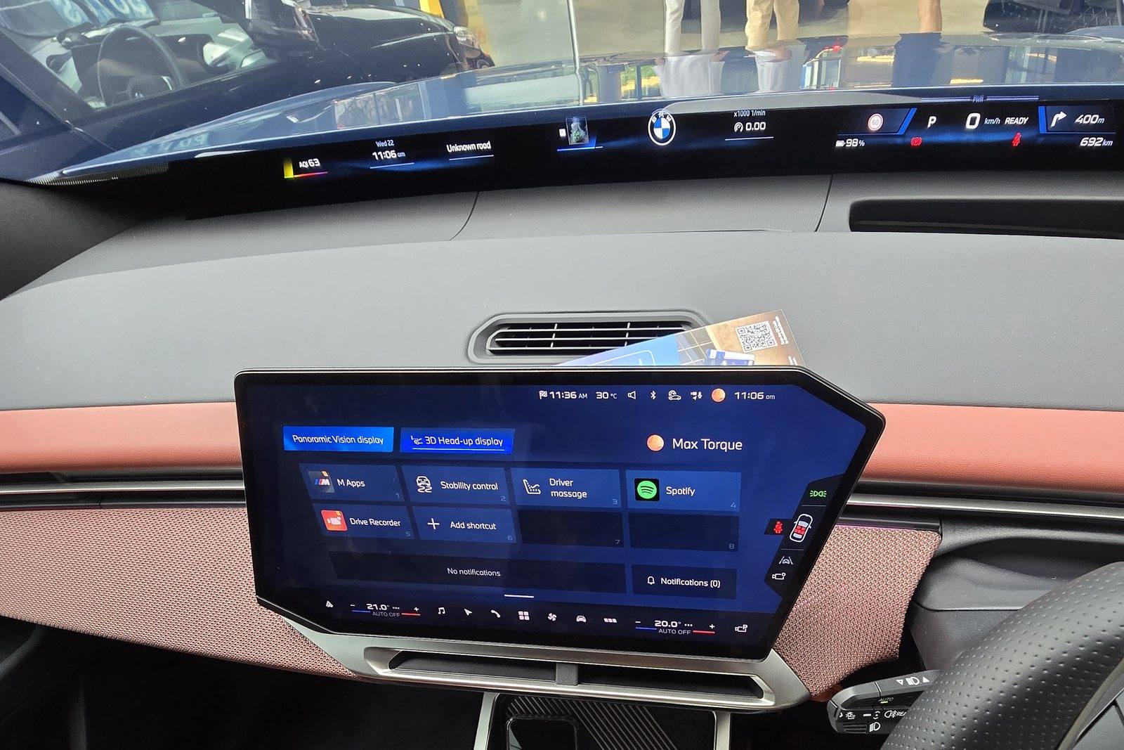 BMW iX3 Panoramic Vision display running across the base of the windscreen, with the central display alongside