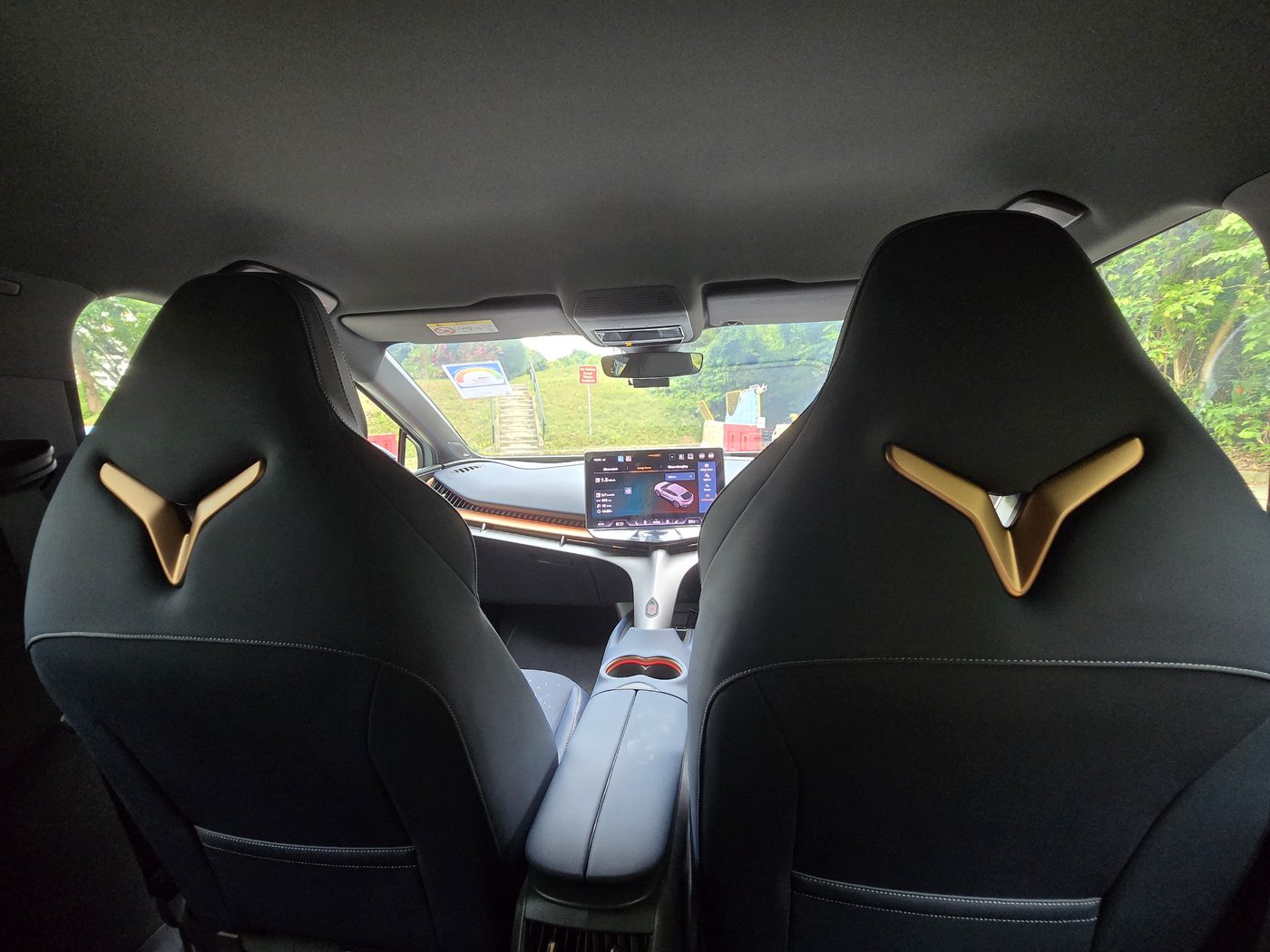 Cupra Tavascan front bucket seats from the rear, with the copper Cupra logo on each headrest