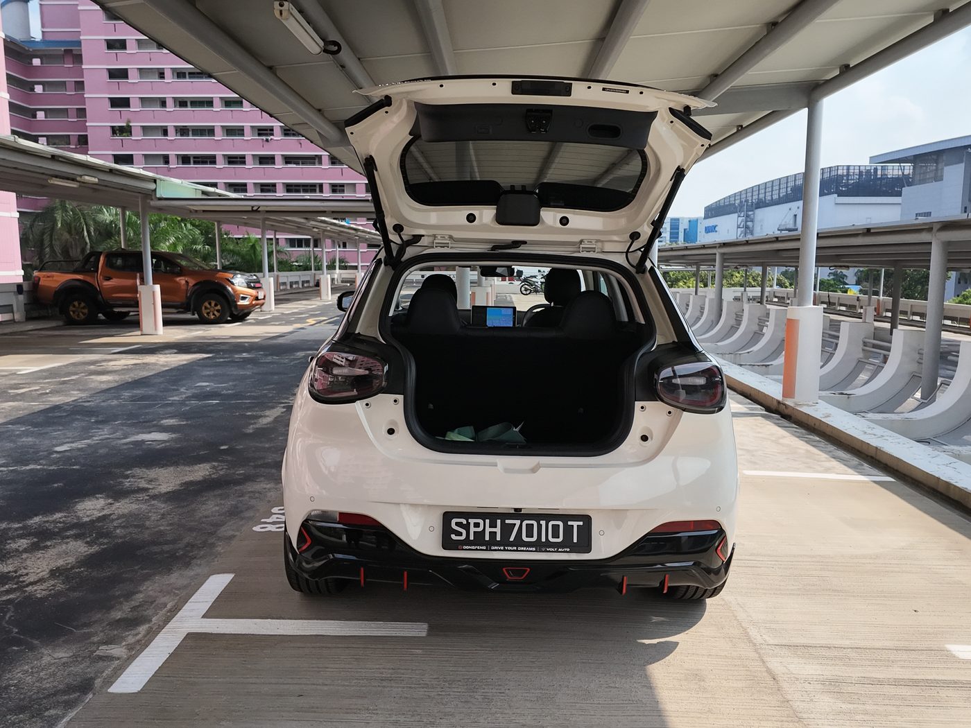 The Dongfeng Box R with its tailgate open, showing the 326-litre boot, in an HDB car park