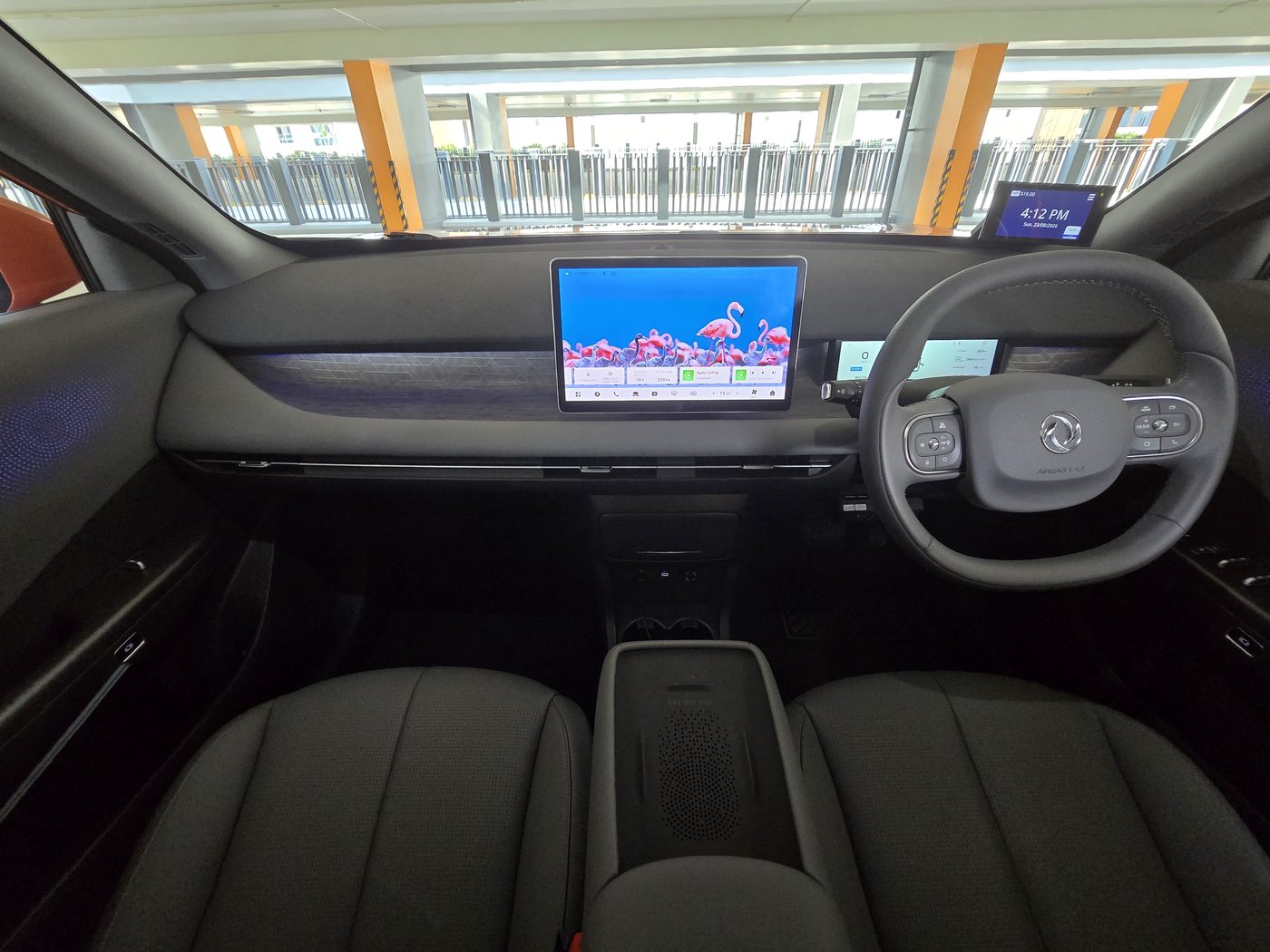 The Dongfeng Vigo dashboard with the 12.8-inch central screen and 8.8-inch driver display, viewed from the back seat