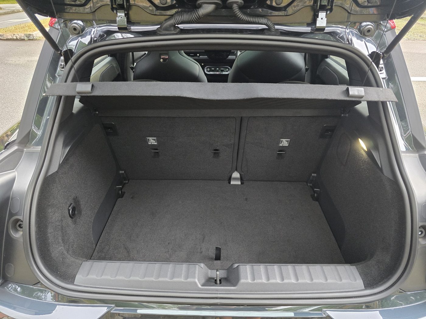 The MINI JCW Aceman E's 300-litre boot with the manual tailgate open