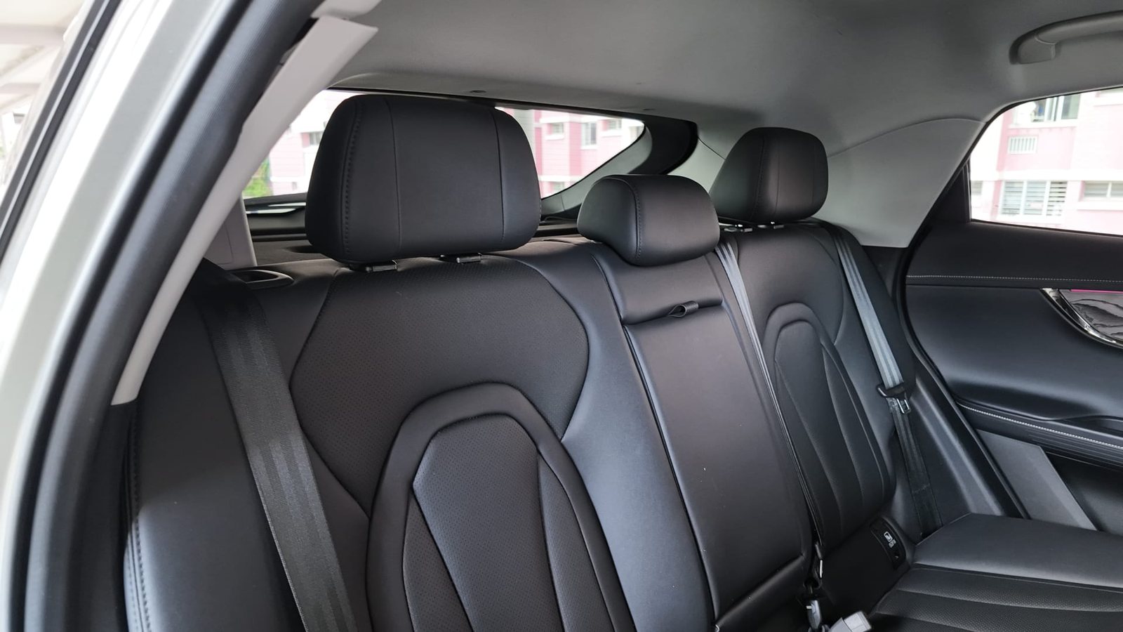 Omoda E5 rear seats showing headroom under the sloping roofline