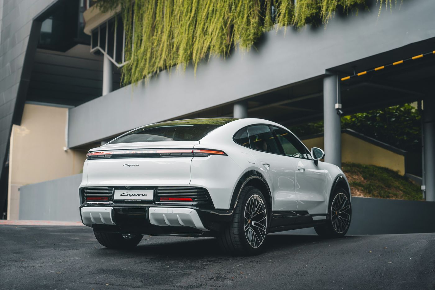 Rear three-quarter view of the Porsche Cayenne Coupé Electric showing its sloping roofline
