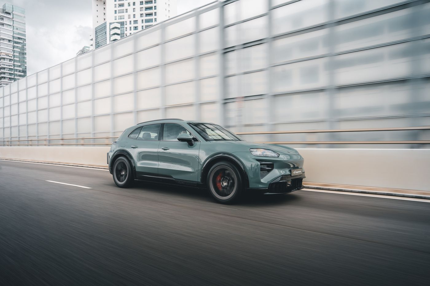 Porsche Cayenne Turbo Electric SUV driving on a Singapore expressway