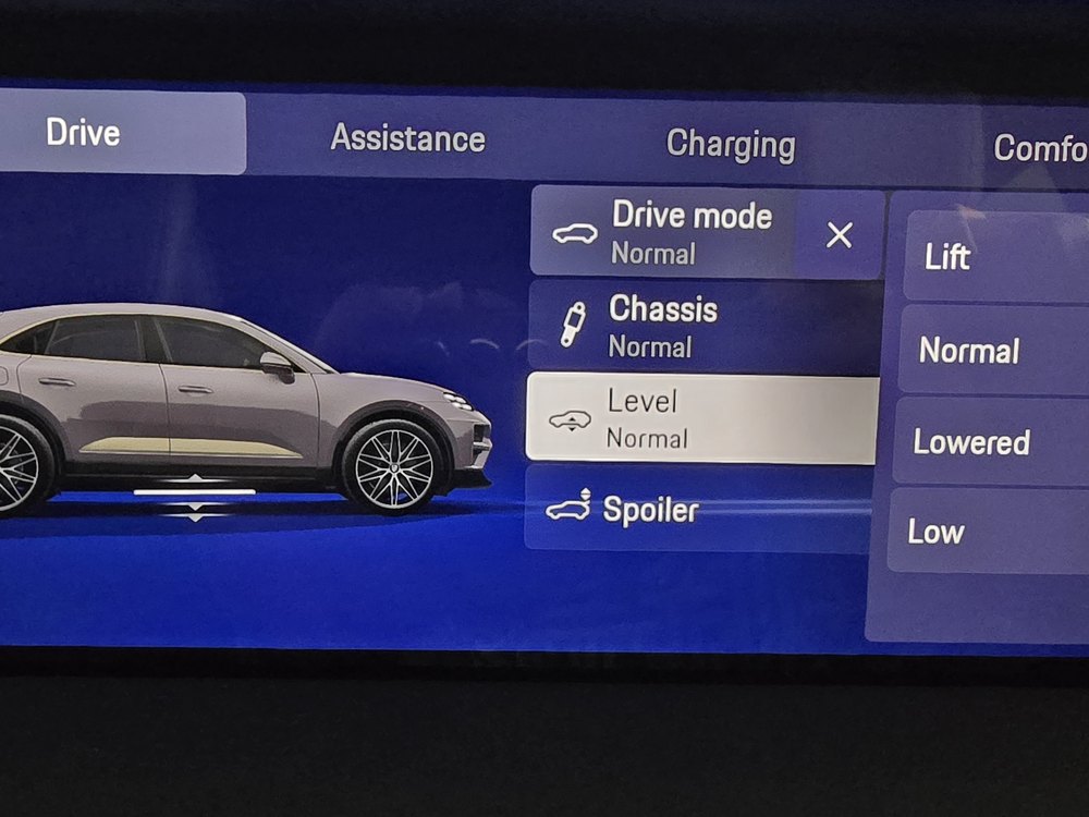 Porsche Macan Electric drive screen with chassis, level and spoiler settings and the ride height options Lift, Normal, Lowered and Low