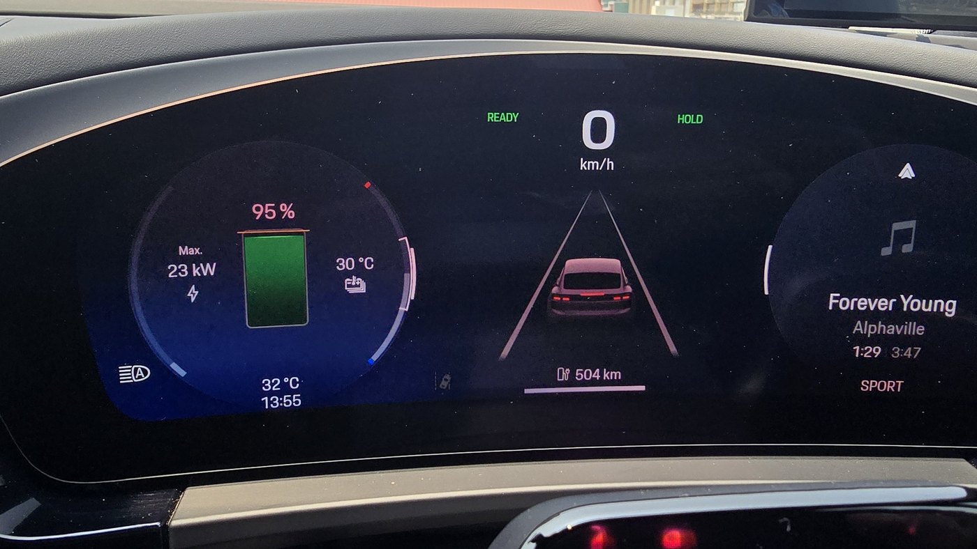 Porsche Macan Electric driver display showing 95 per cent battery and an estimated 504 km of range in Sport mode