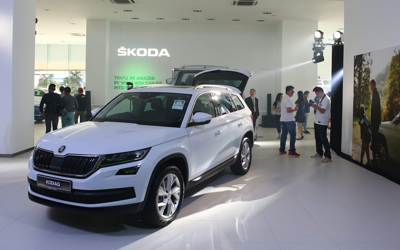 A white Kodiaq with its tailgate open on the showroom floor at Škoda Centre Singapore
