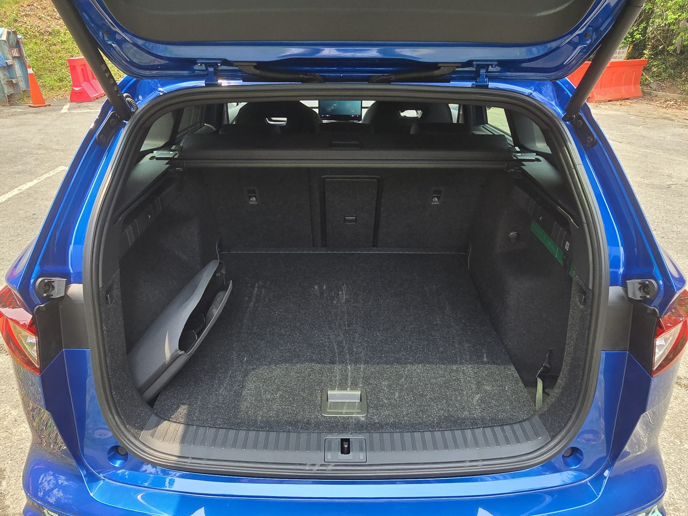 Skoda Enyaq boot with the tailgate open, showing the square 585 litre load space
