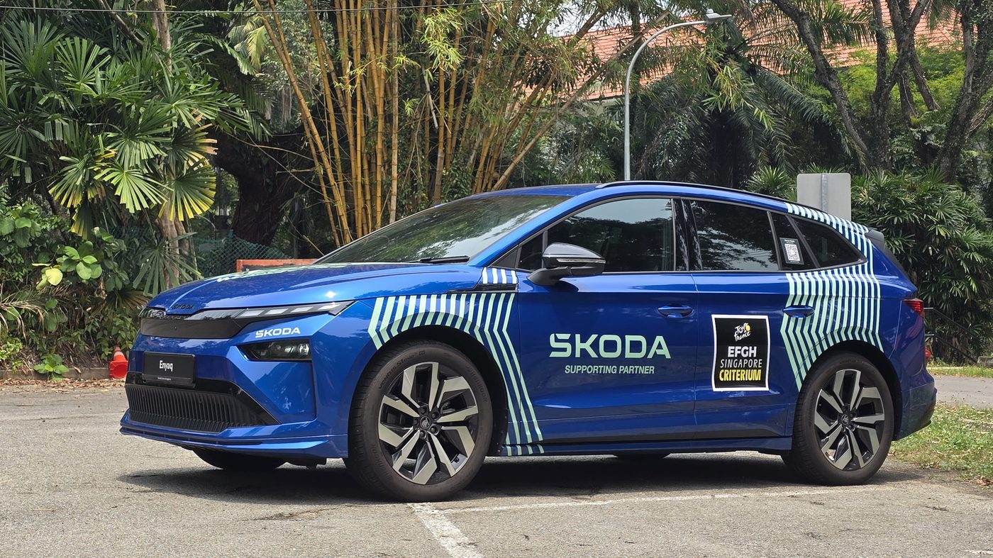 Skoda Enyaq Sportline rear three-quarter view under trees in a Singapore carpark