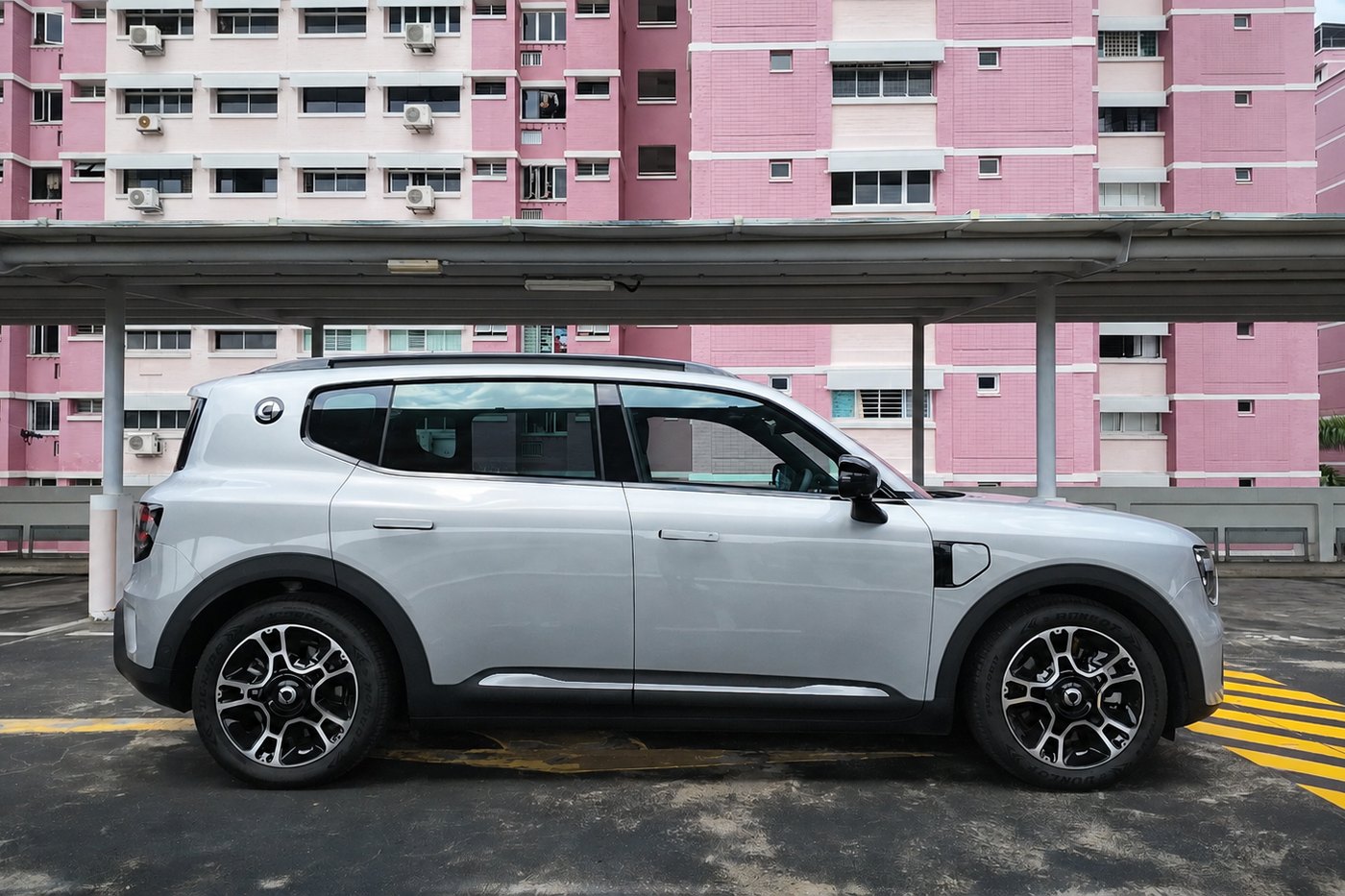 smart #5 Pro in profile on a carpark deck, showing its boxy SUV silhouette against pink HDB blocks