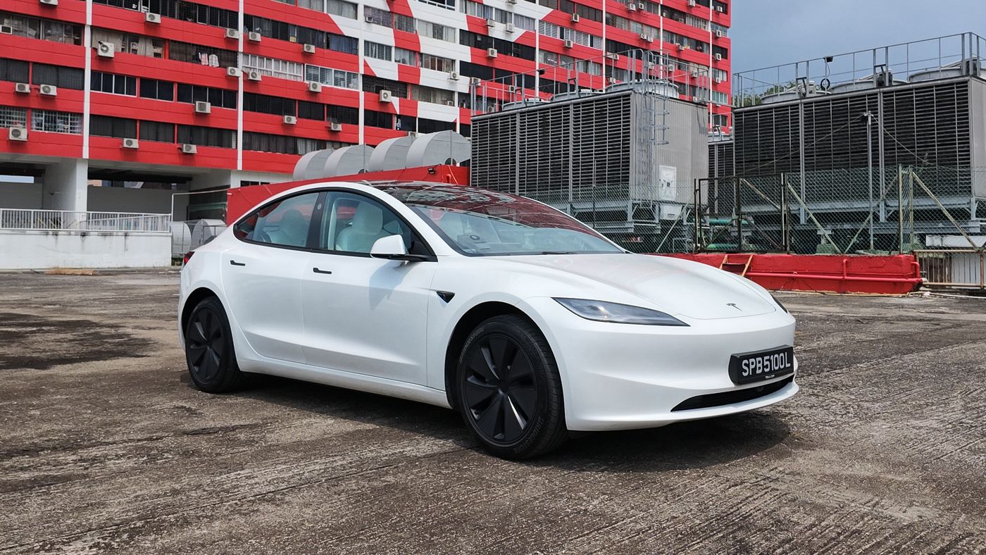 White Tesla Model 3 Long Range front three-quarter view on a rooftop carpark in Singapore