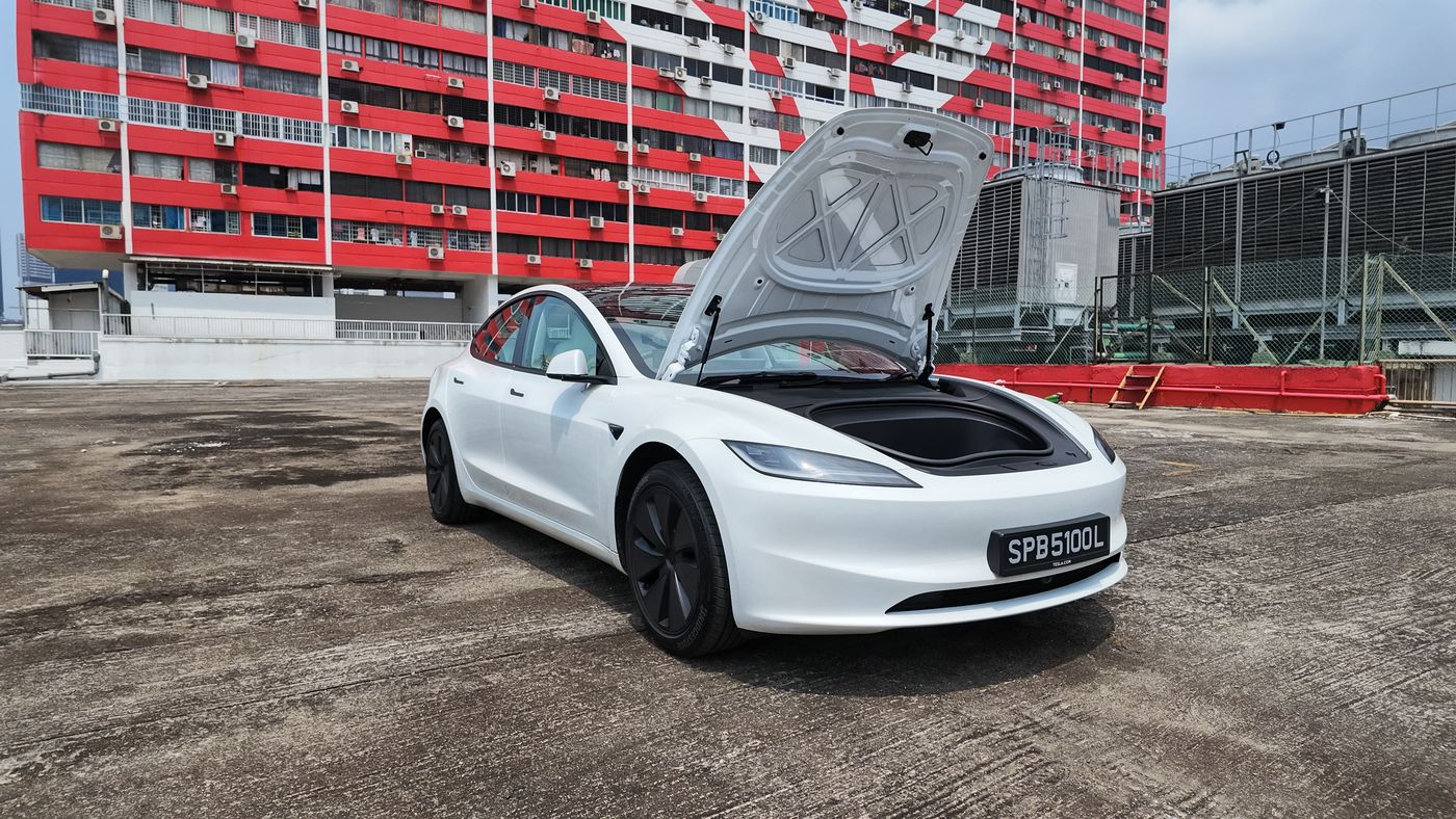Tesla Model 3 with the front bonnet open showing the frunk