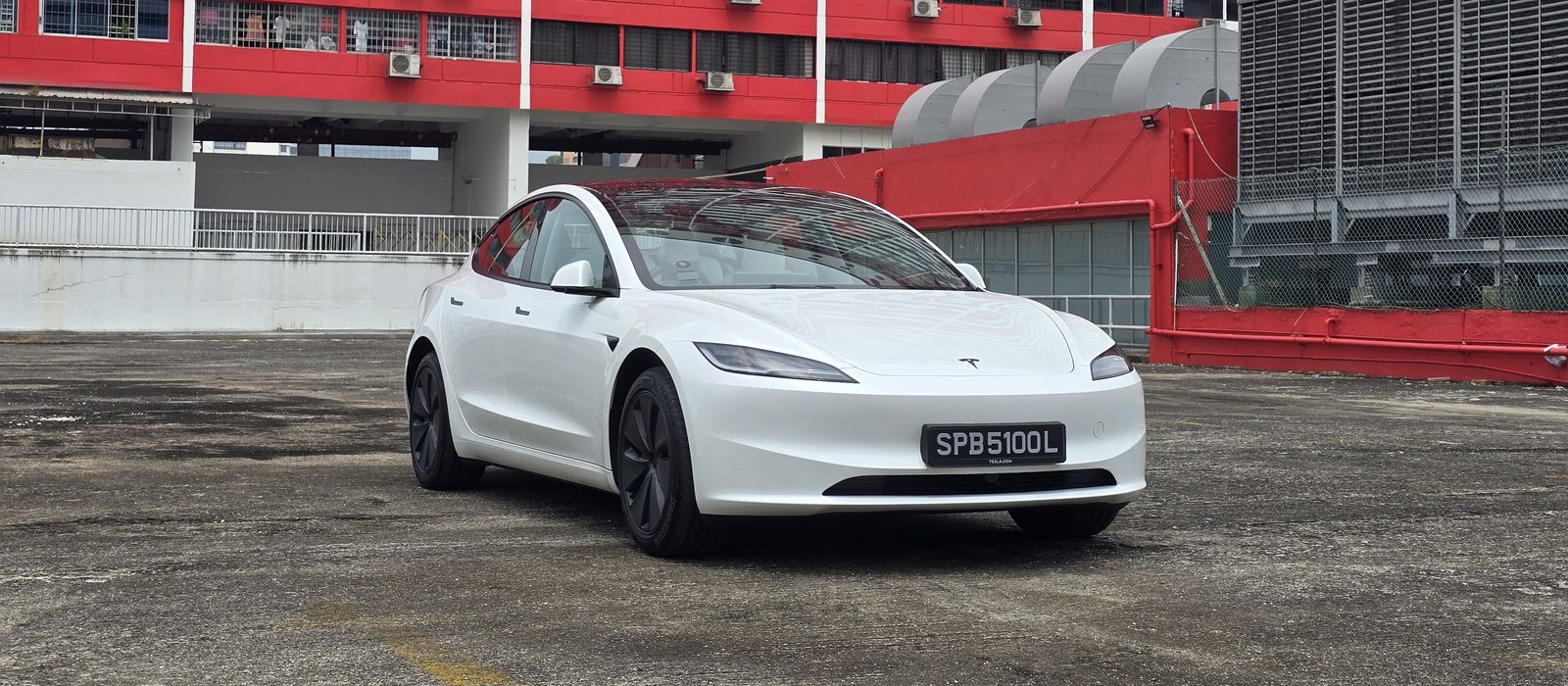 White Tesla Model 3 Long Range on a rooftop carpark in Singapore