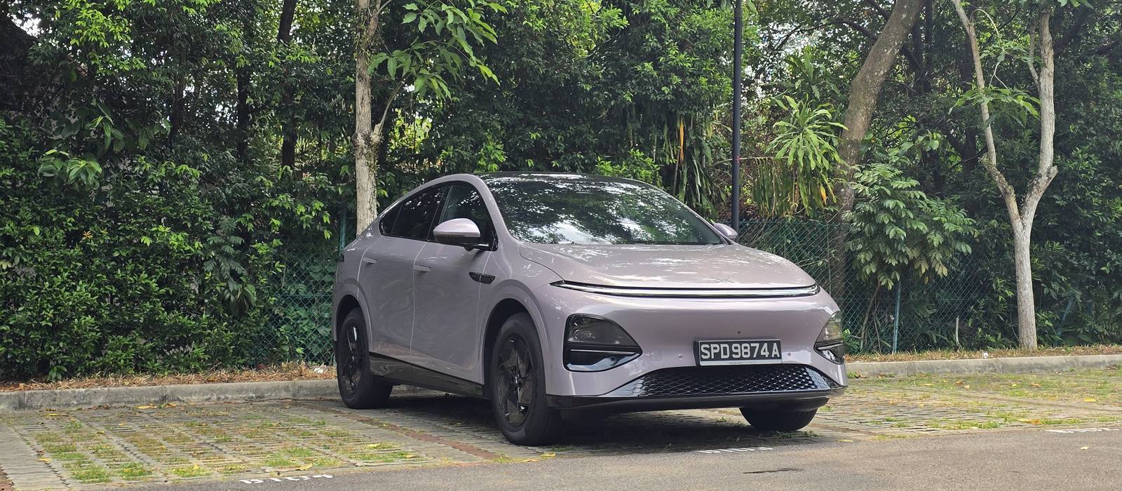 XPENG G6 Air in Stellar Purple parked under trees in Singapore