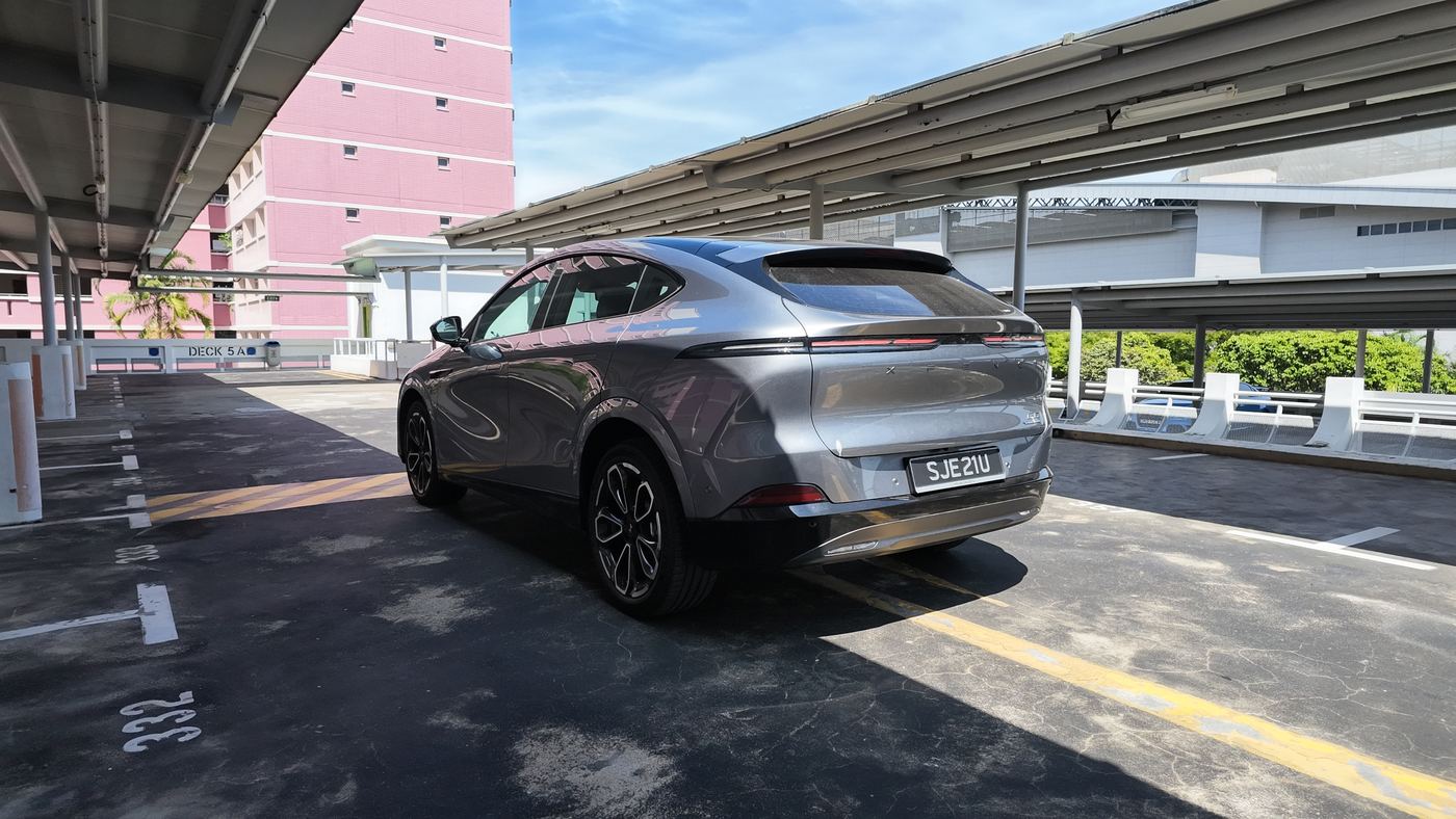 XPENG G6 Performance rear three-quarter view showing the ducktail spoiler