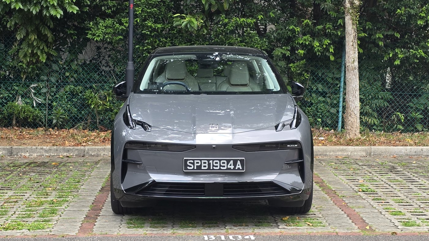 Grey Zeekr X Urban head-on, showing the slim slot headlights and the flat front